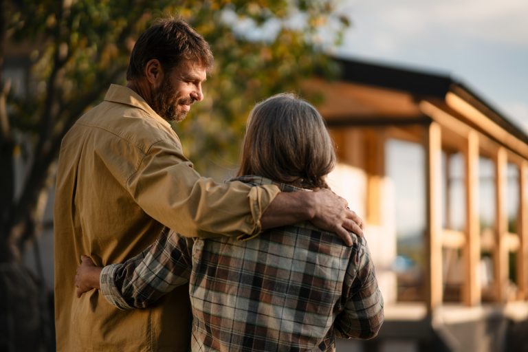 Couple looking toward a house they are planning for their future